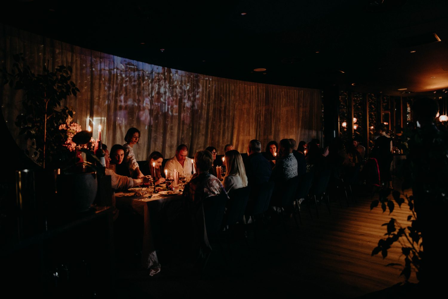 The room set for a candlelit private event