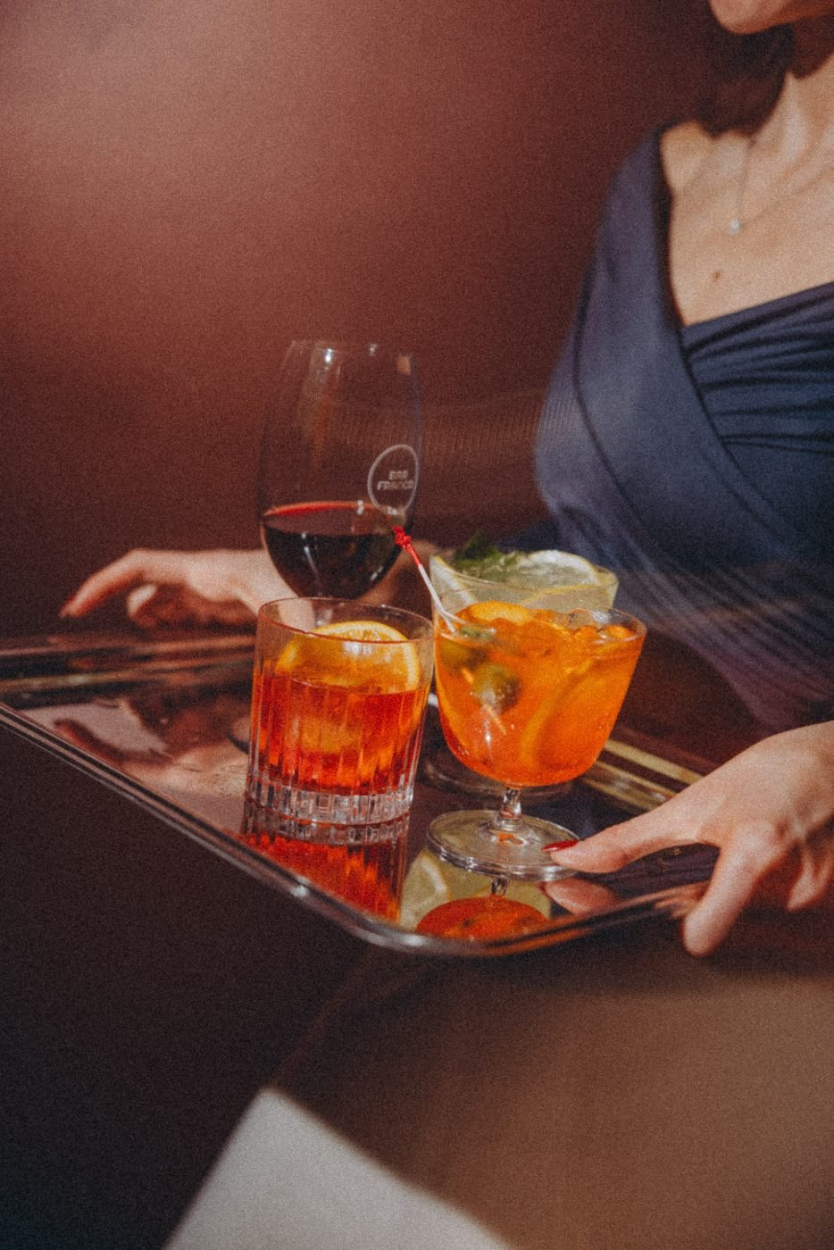 Negronis carried on a tray
